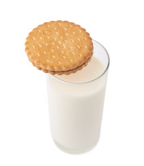 Glass of milk and cookie isolated over the white background