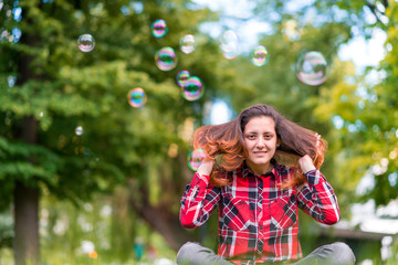 beautiful young woman blowing bubble outdoor happy lifestyle