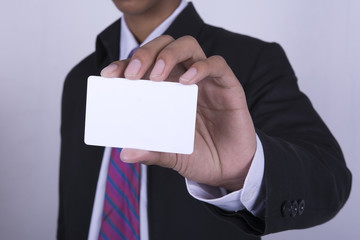 man's hand showing business card - select focus