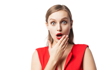 Astonished woman with open mouth looking at camera
