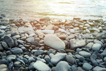 Nature background with pebble on sunset