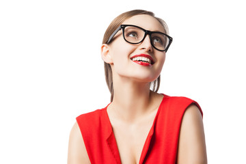 Fair-haired woman with red lips smiling while looking up