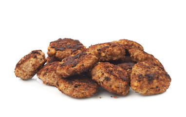 Pile of small hand made cutlets isolated over white background