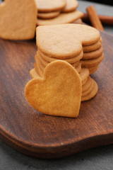 Heart shaped biscuits on cutting board, closeup