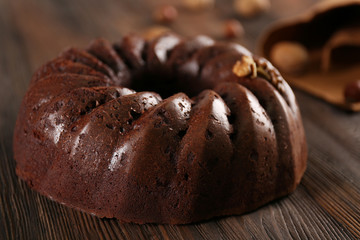 Chocolate cake on wooden background, closeup