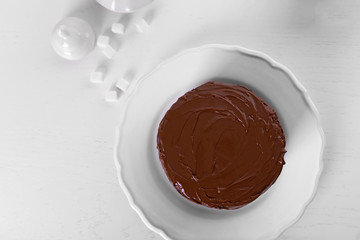 Tasty chocolate cake on light background