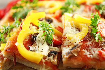 Pieces of delicious pizza on the table, close-up