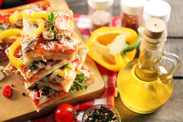 Pieces of delicious pizza on the table, close-up