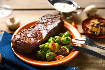 Grilled steak with vegetables, closeup