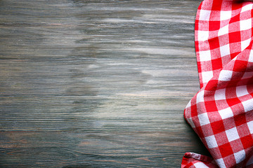 Checkered napkin on wooden background