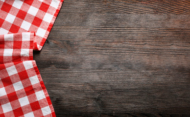 Checkered napkin on wooden background