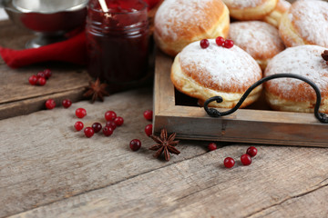 Fresh homemade donuts with powdered sugar, close up