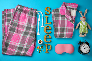 Insomnia concept. Sleeping accessories on blue background