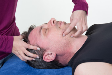 Fototapeta na wymiar At spa center man receiving head massage