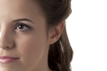 Fototapeta premium half face of a woman looking away