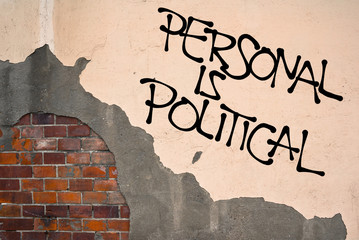 Handwritten graffiti Personal Is Political sprayed on wall, anarchist aesthetics - connections...