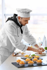 Male chef working at kitchen