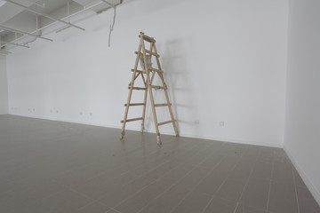 new bright empty interior and wooden ladder