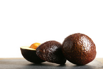 Fresh avocado on the table isolated on white