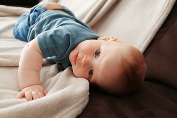 Adorable baby on the couch