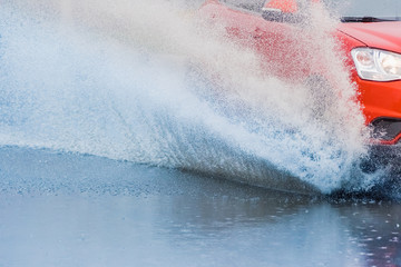 car rain puddle splashing water