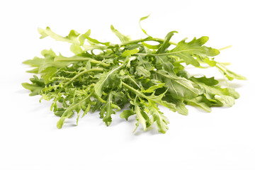 Fresh arugula leaves on white background