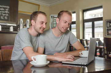 gay couple looking through their photos together