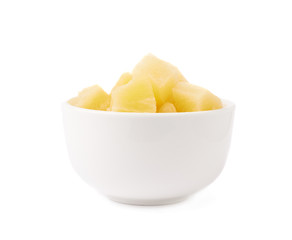 Pile of canned pineapple over isolated white background