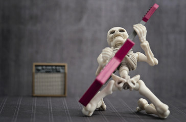 A Skeleton playing rock electric guitar