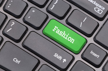 Computer keyboard closeup with "Fashion" text on green enter key