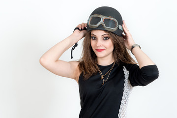 Fashion portrait of sexy stunning hipster woman, bright make up, vintage sunglasses, biker leather jacket, trendy jewelry and accessorizes. Urban wall background. Photoshoot relaxed biker