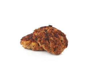Couple of small hand made cutlets isolated over white background