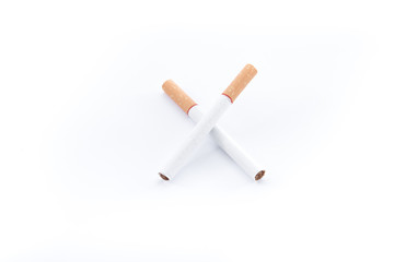Cigarette with brown filter on white background