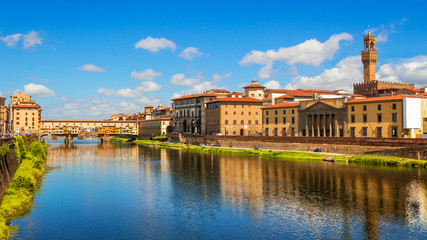 Fototapeta premium Florence, Ponte Vecchio bridge over river Arno and Palazzo Vecchio (Tuscany, Italy)