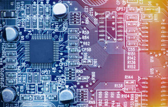 Printed circuit board with chips and other electronic components. Computer and networking communication technology concept. Toned image.