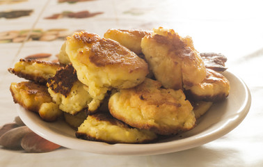 Home cheese pancakes from pot cheese in plate