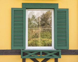 Window with open wooden shutters