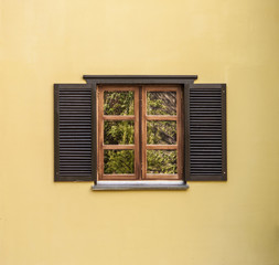 Window with open wooden shutters