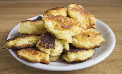 Home cheese pancakes from pot cheese in plate