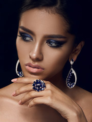 blue sapphires and diamonds on a beautiful girl, lips,