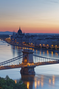 Hungary, Budapest, View to Pest with parliament building, Chain bridge and Danube river, afterglow