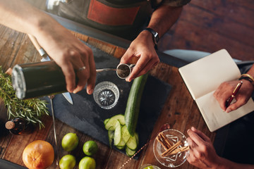 Two barmen experimenting new cocktail recipe © Jacob Lund