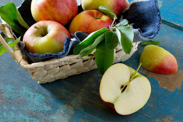 Harvest fresh organic ripe pears in a wicker basket on a rustic