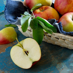 Harvest fresh organic ripe pears in a wicker basket on a rustic
