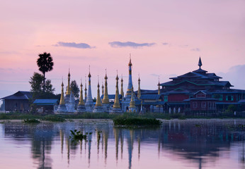 Ancient pagoda and monastery at sunrise on Inle lake, Myanmar