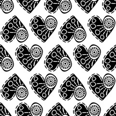 Seamless vector pattern with hearts. Black and white abstract background with drawn elements and ornamental symbols. Decorative repeating ornament.