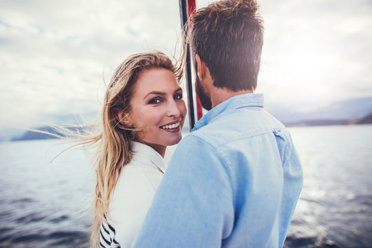 Loving young couple on a romantic boat trip