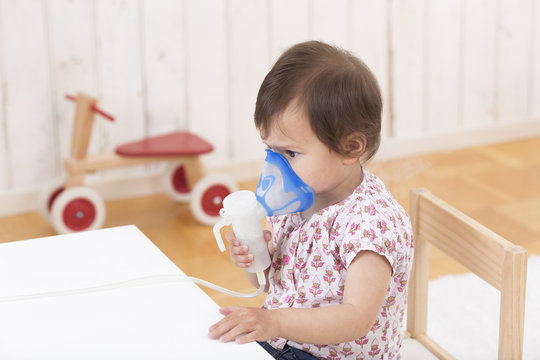 Girl using inhaler