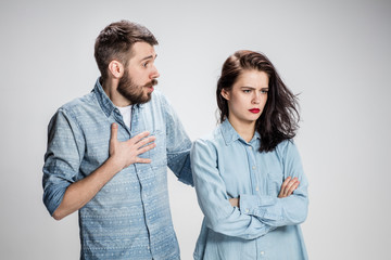 The young couple with different emotions during conflict