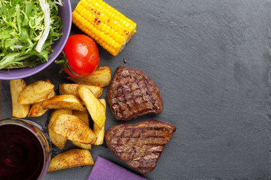 Beef Steak With Grilled Potato, Corn, Salad And Red Wine